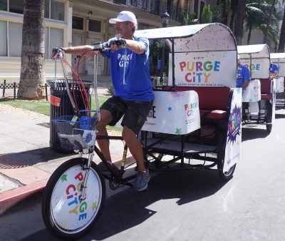 San Diego Pedicab driver riding pedicab